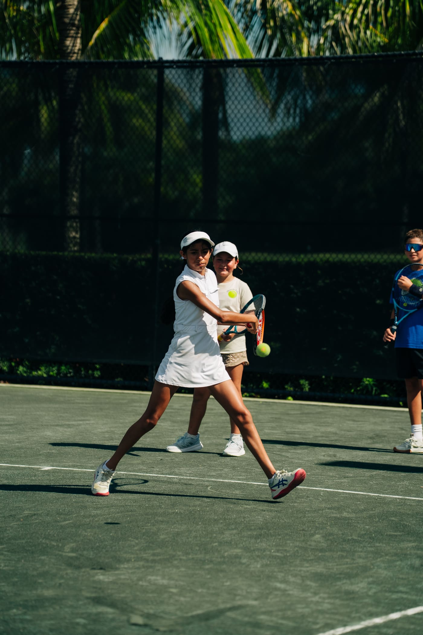 Adult player hitting on the academy courts